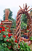 TERRACOTTA POT ARCHWAY, WITH PELARGONIUMS