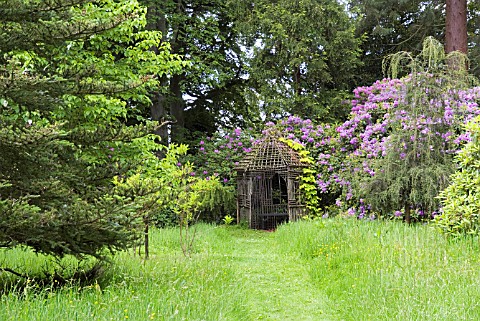 RUSTIC_SUMMERHOUSE_IN_THE_RIVERSIDE_GARDEN_AT_PITMUIES_HOUSE_FORFARSHIRE_SCOTLAND