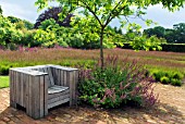 SEAT IN THE DRIFTS OF GRASS GARDEN IN SCAMPSTON WALLED GARDEN