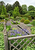 THE UPPER LEVEL OF THE RILL GARDEN WITH BUXUS SEMPERVIREN TOPIARY AT WOLLERTON OLD HALL