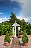 BRICK PATH WITH BUXUS TOPIARY IN CONTAINERS, LEADING TO SUMMERHOUSE AT WOLLERTON OLD HALL