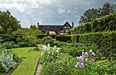 TWIN BORDERS BURSTING WITH HERBACEOUS PERENNIALS AT WOLLERTON OLD HALL