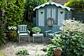 WOODEN SUMMERHOUSE AND SEATING AREA AT WESTON OPEN GARDENS