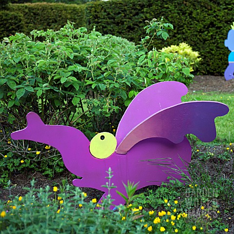 CHILDRENS_GARDEN_WITH_COLOURFUL_CONTEMPORARY_STATUARY_AT_GARDEN_ART_WITHIN_CONWY_VALLEY_MAZE