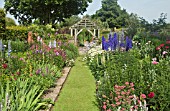 DEEP BORDERS OF MIXED COLOURS, GRASS PATH LEADING TO OAK PERGOLA AT WOLLERTON OLD HALL