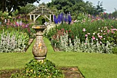 STONE SUNDIAL IN LAWN AT WOLLERTON OLD HALL