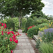 BORDERS OF HERBACEOUS PERENNIALS, CLIPPED HEDGES, PATHWAYS, BENCHES AND MATURE TREES AT WOLLERTON OLD HALL