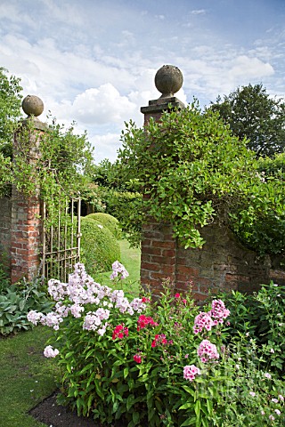 OPEN_IRON_GATES_WITH_HONEYSUCKLE_AT_WOLLERTON_OLD_HALL