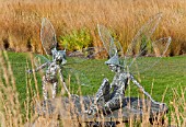 FAIRIES ON TABLE IN AT TRENTHAM GARDENS STAFFORDSHIRE IN NOVEMBER DESIGNED BY PIET OUDOLF