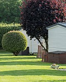 Static caravan holiday park with exclusively privately owned holiday homes set among trees, shrubs and flowers and sweeping well manicured lawns the park is situated minutes from the seaside resorts of Ceredigion