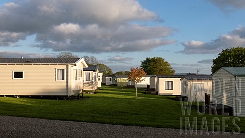 Holiday_static_caravan_park_with_exclusively_privately_owned_holiday_homes_set_among_trees_shrubs_an