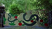 Contemporary hand crafted steel gate sculpture of Eve the apple and the Serpent