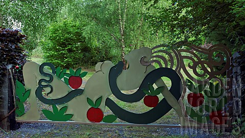 Contemporary_hand_crafted_steel_gate_sculpture_of_Eve_the_apple_and_the_Serpent