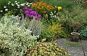 Mixed border of summer flowering herbaceous perennials and ornamental grasses
