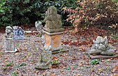 Gravelled garden with a collection of ornamental stone figures