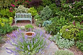 Seating area herbaceous perennial borders circlular slate area