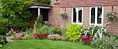 Front garden with mixed border under windows