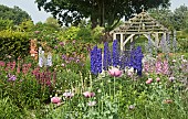 Deep borders of mixed colours and varieties of herbaceous perennials