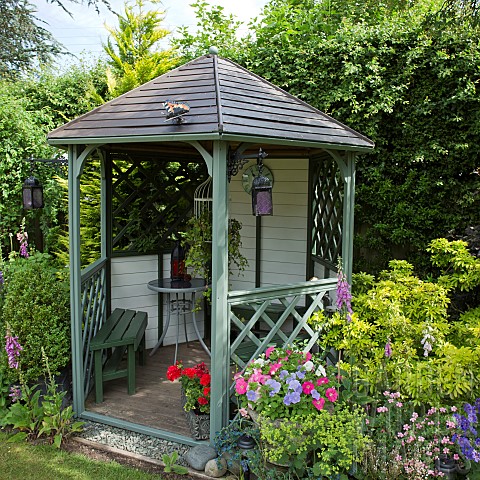Wooden_Gazebo_containers_planted_with_Petunias_and_Pelargoniums