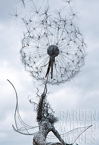 Stainless_Steel_sculpture_of_Fairy_blowing_a_dandelion_clock