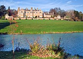 Batsford House, and Lake, Autumn colour at Batsford Arboretum, Batsford, Moreton in the Marsh, Gloucestershire, England, United Kingdom, UK, Europe