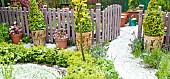 High Meadow Garden mature trees and shrubs after hail storm in late spring May