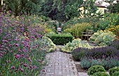 FORMAL PAVED GARDEN WITH MIXED BORDER PLANTING