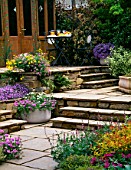TERRACED PATIO GARDEN, WITH FLOWERING CONTAINER PLANTING