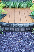 CHIPPED SLATE AGAINST RAISED DECKING