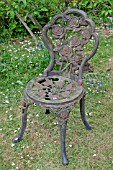 WEATHERED CAST IRON GARDEN CHAIR