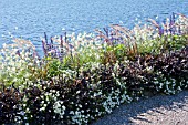 FLOWER BORDER BESIDE A LAKE