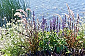 FLOWER BORDER BESIDE A LAKE