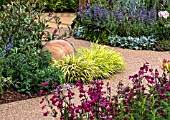 PATH OF RESIN COATED SHINGLE EDGED WITH COLOURFUL PERENNIALS