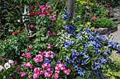 MIXED BORDER WITH PERENNIALS CLEMATIS STATUES SHRUBS