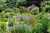 GERANIUM, PAPAVER ORIENTALE, ROSA, PAEONIA, DIGITALIS  WITH GARDEN PAVILION. DESIGN: MARIANNE AND DETLEF LUEDKE