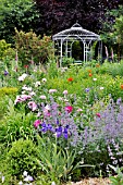 NEPETA, IRIS, PAEONIA, PAPAVER ORIENTALE, WITH GARDEN PAVILION. DESIGN: MARIANNE AND DETLEF LUEDKE