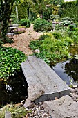 GARDEN POND WITH STONE BRIDGE. DESIGN: MARIANNE AND DETLEF LUEDKE