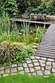 SWIMMING POND WITH WOODEN DECKING AREA