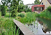 SWIMMING POND WITH WOODEN DECKING AREA