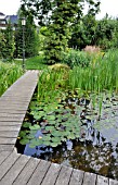 SWIMMING POND WITH WOODEN DECKING AREA