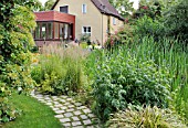 PERENNIAL BORDER AT A GARDEN POND