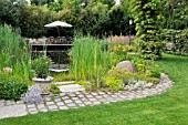 SWIMMING POND WITH WOODEN DECKING AREA AND SEATS