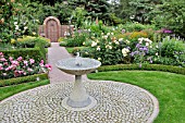 GRANITE FOUNTAIN IN A ROSE GARDEN