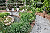 SEMICIRCULAR PLATEAU WITH SEATING AREA  WATER BASIN AND PERGOLA