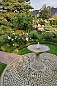 GRANITE FOUNTAIN IN A ROSE GARDEN