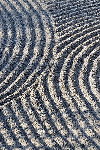 RAKED_GRAVEL_IN_A_DRY_LANDSCAPE_GARDEN