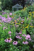 ECHINACEA PURPUREA, PHLOX PANICULATA AND HELIOPSIS HELIANTHOIDES WITH GARDEN PAVILION. DESIGN: MARIANNE AND DETLEF LUEDKE