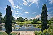 RHS GARDEN HYDE HALL. THIS IS THE VIEW FROM THE TOP POND TOWARDS THE HILLTOP GARDEN