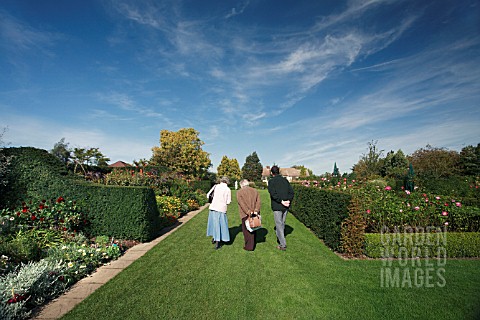 VISITORS_STROLL_THROUGH_THE_MODERN__ROSE_GARDEN_AND_HERBACEOUS_BORDERS_AT_RHS_GARDEN_HYDE_HALL__IN_O