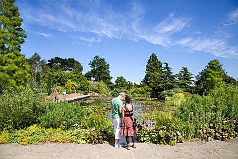 VISITORS_WANDER_AROUND_THE_TOP_POND_AT_RHS_HYDE_HALL_GARDENS